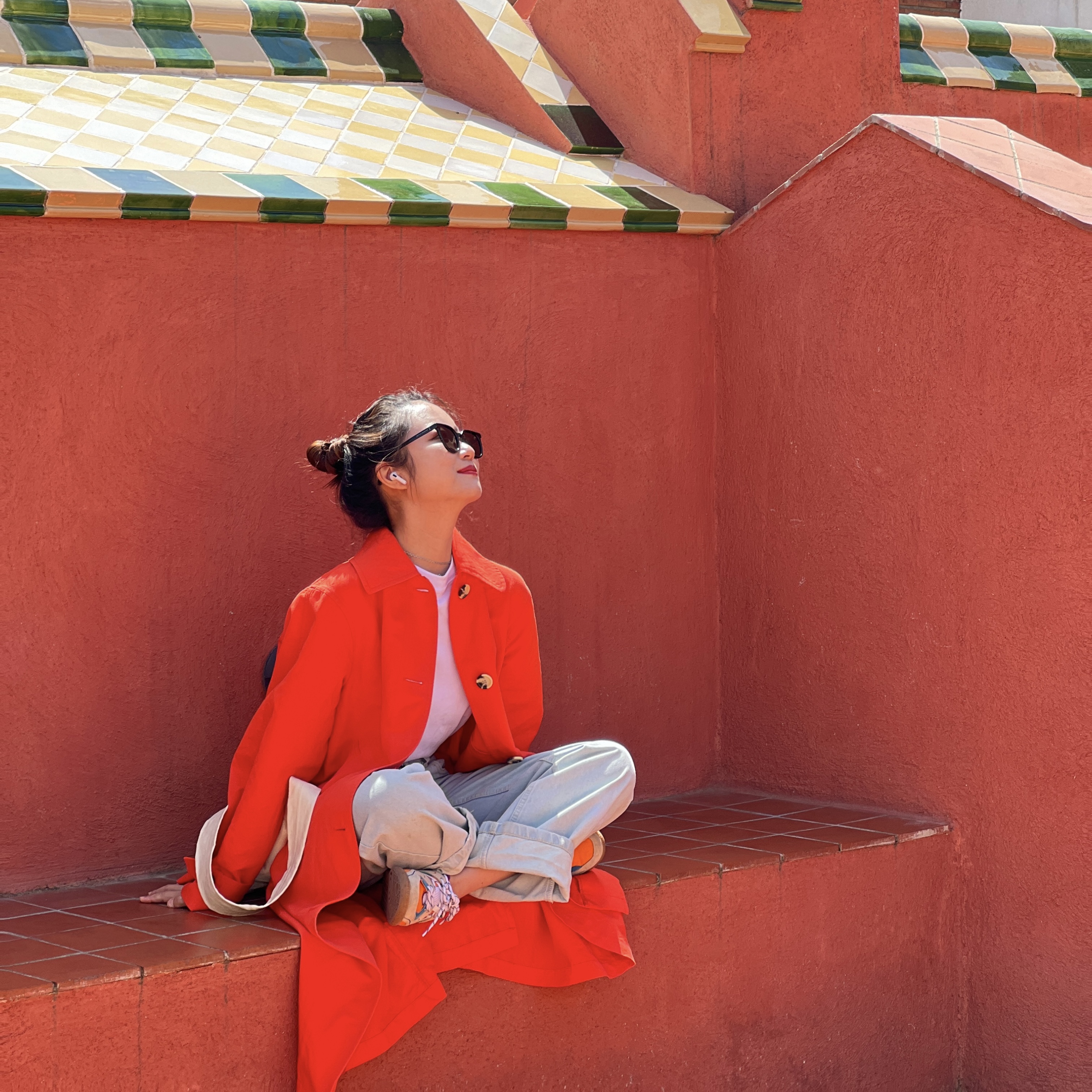 person smiling wearing orange clothing